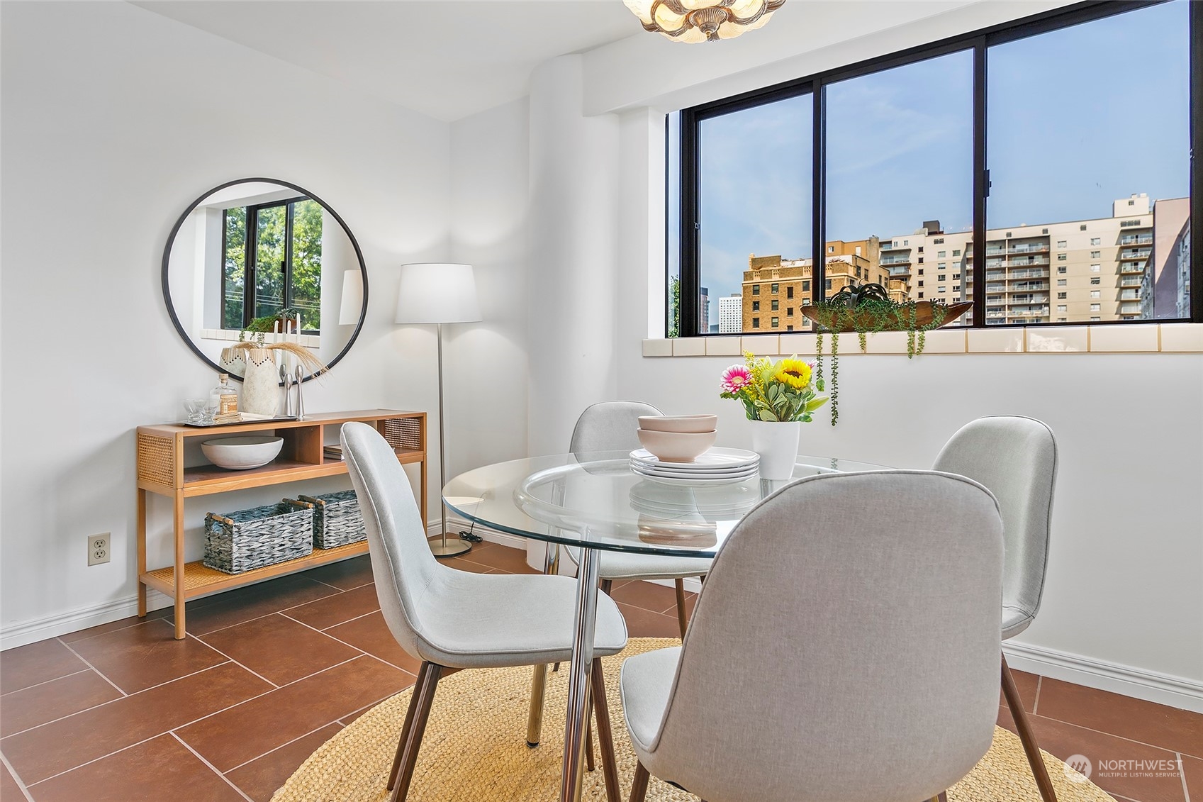 1120 Spring Street, Unit 401 Seattle, WA 98104 - Photo 12 of 34 a dining room with furniture and a window