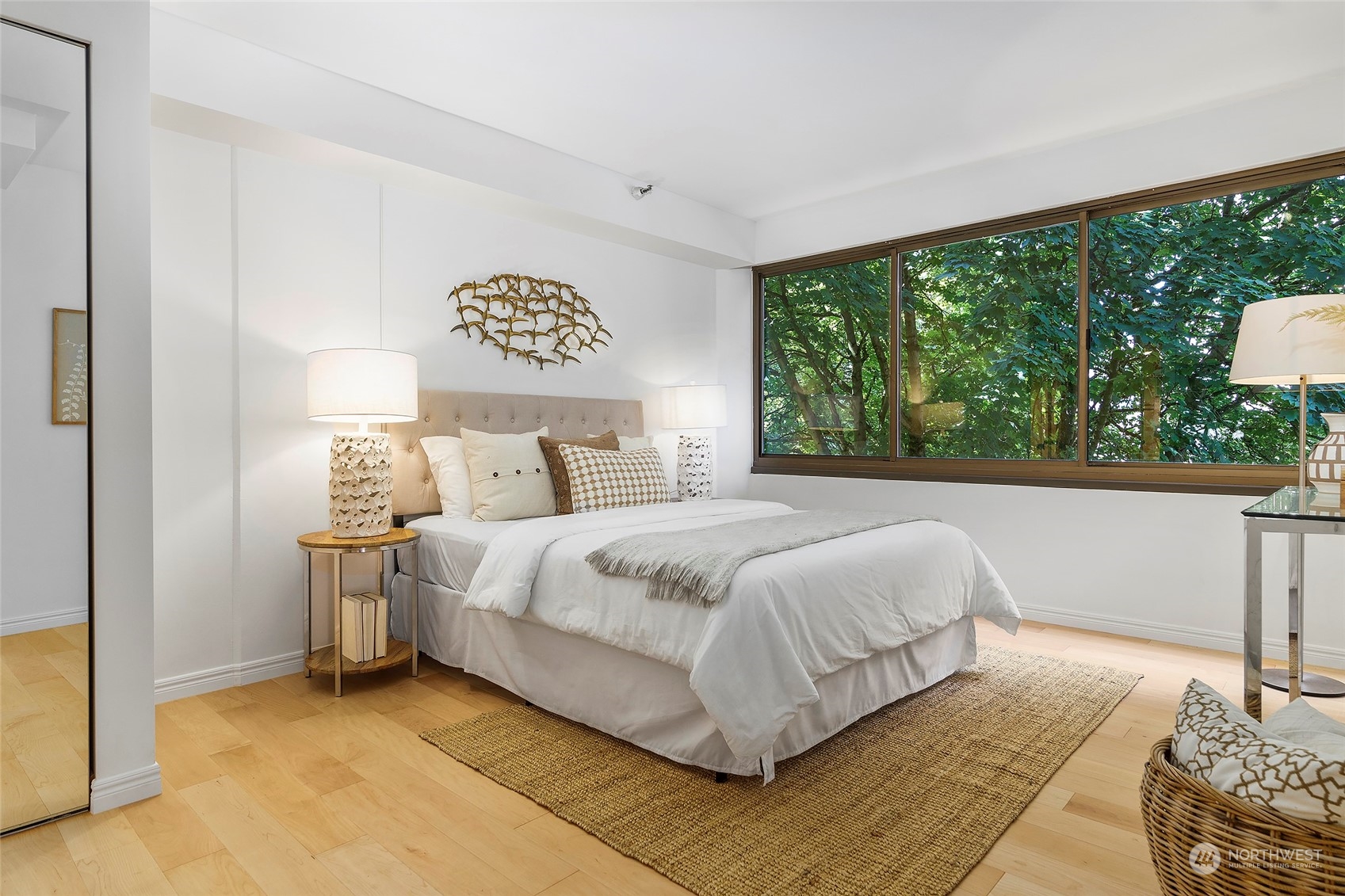 1120 Spring Street, Unit 401 Seattle, WA 98104 - Photo 18 of 34 a bedroom with a bed and a large window