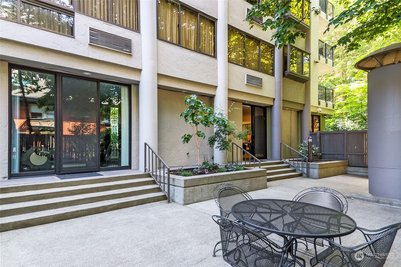 1120 Spring Street, Unit 401 Seattle, WA 98104 - Photo 23 of 34 a view of a building with a outdoor space