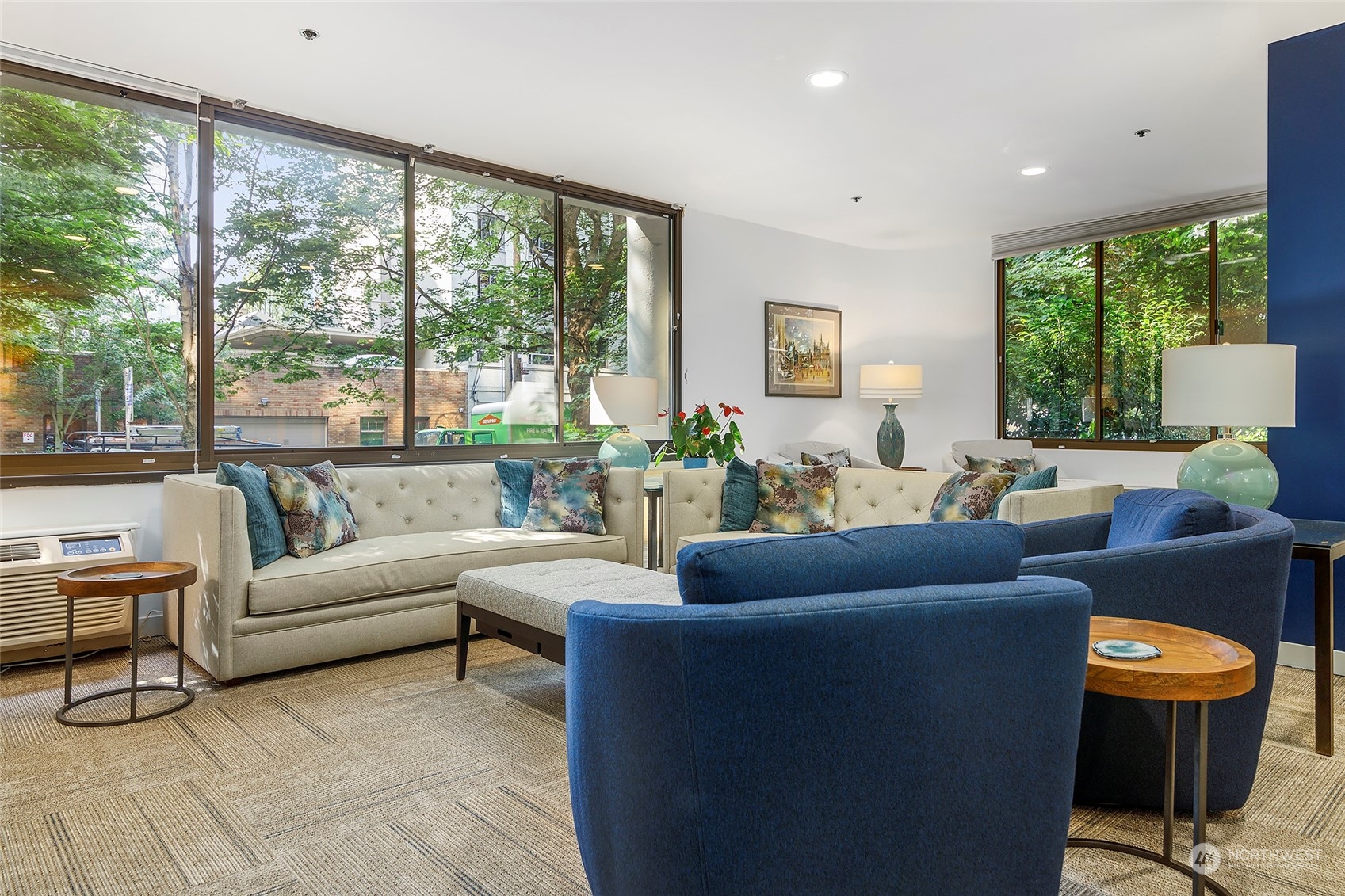 1120 Spring Street, Unit 401 Seattle, WA 98104 - Photo 24 of 34 a living room with furniture and a large window