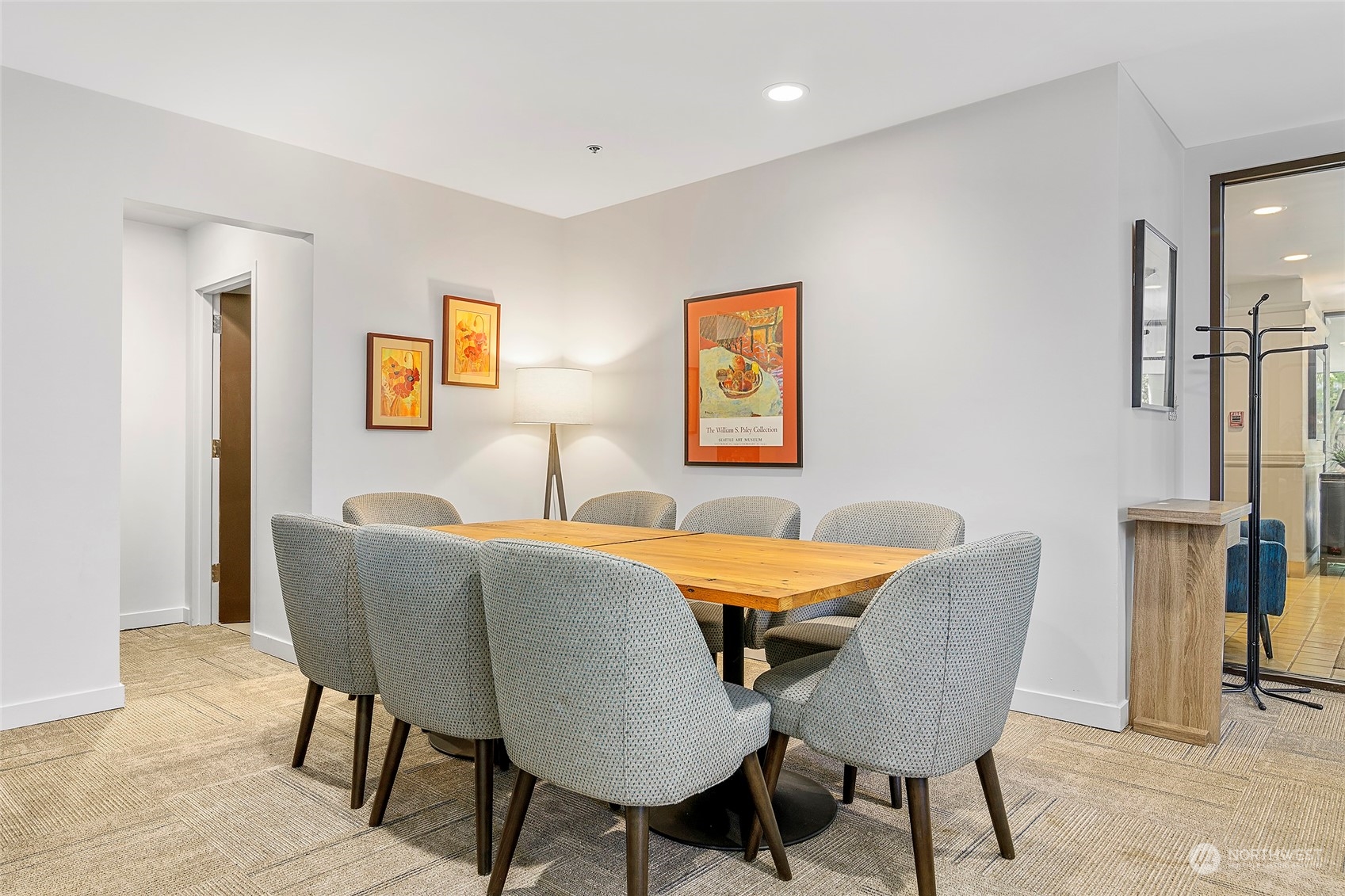1120 Spring Street, Unit 401 Seattle, WA 98104 - Photo 25 of 34 a view of a dining room with furniture and a potted plant