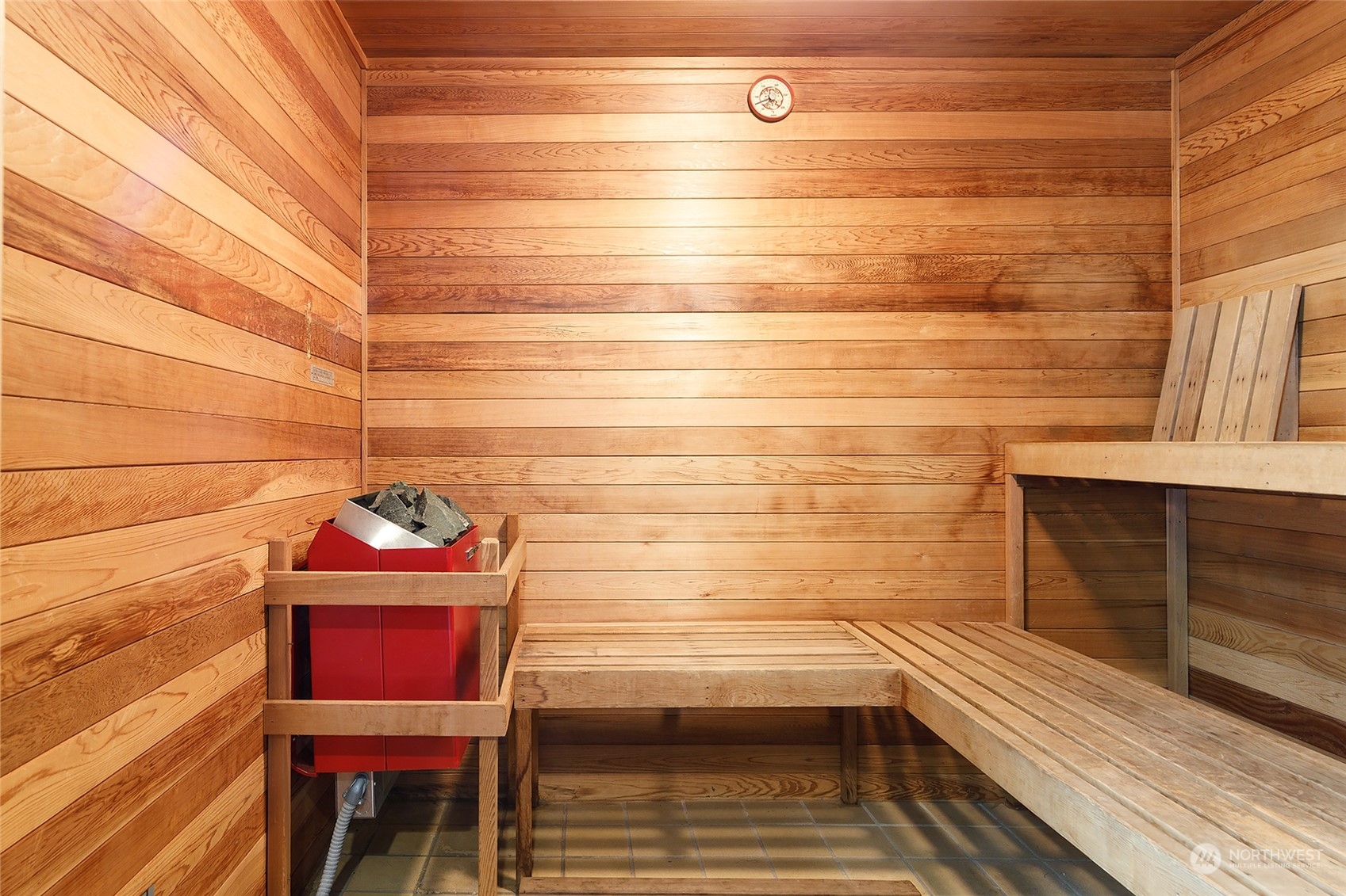 1120 Spring Street, Unit 401 Seattle, WA 98104 - Photo 30 of 34 a bathroom with a sink and a vanity