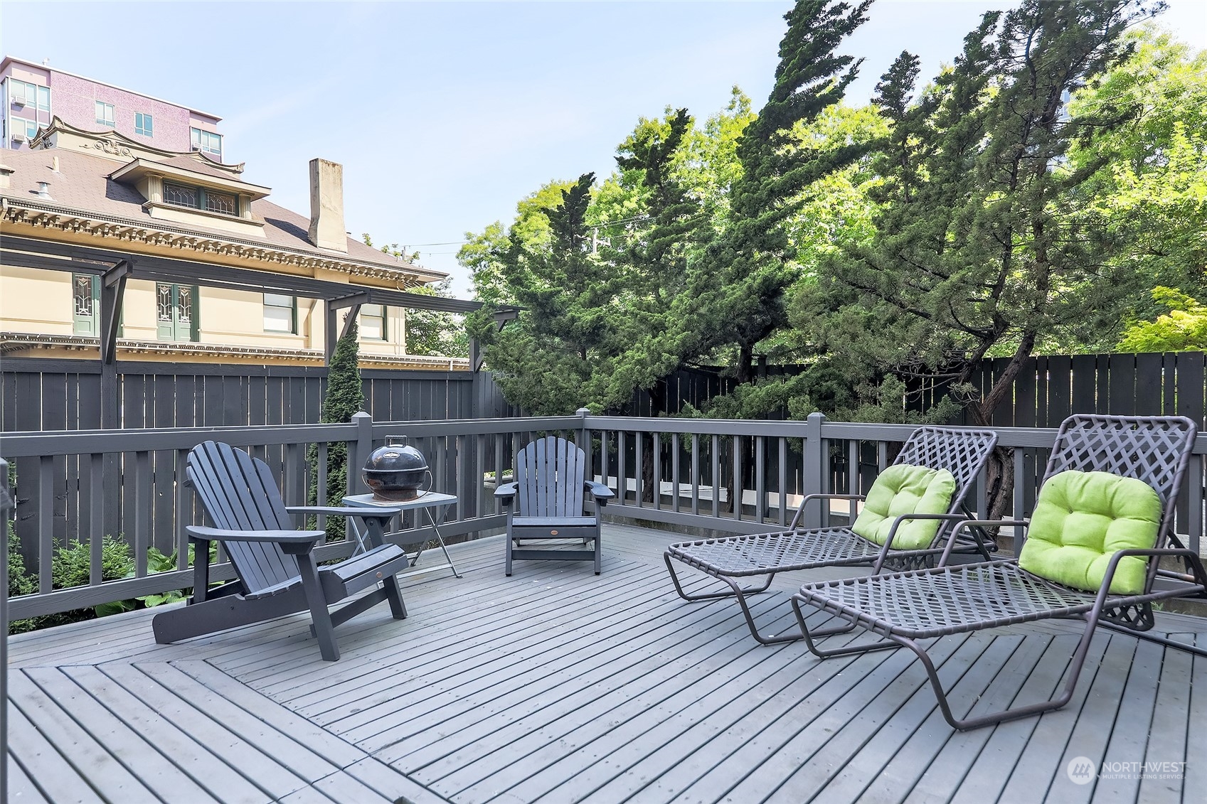 1120 Spring Street, Unit 401 Seattle, WA 98104 - Photo 31 of 34 a view of a chairs on wooden deck