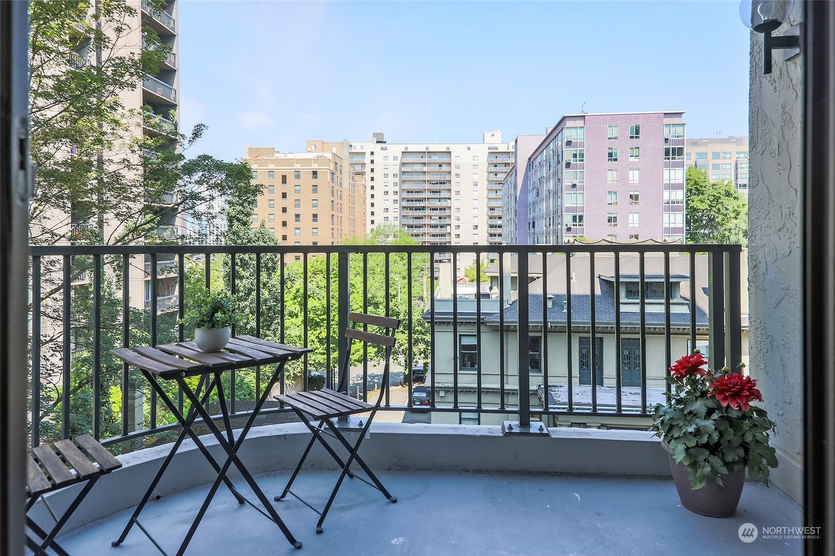1120 Spring Street, Unit 401 Seattle, WA 98104 - Photo 10 of 34 a view of a balcony with chairs