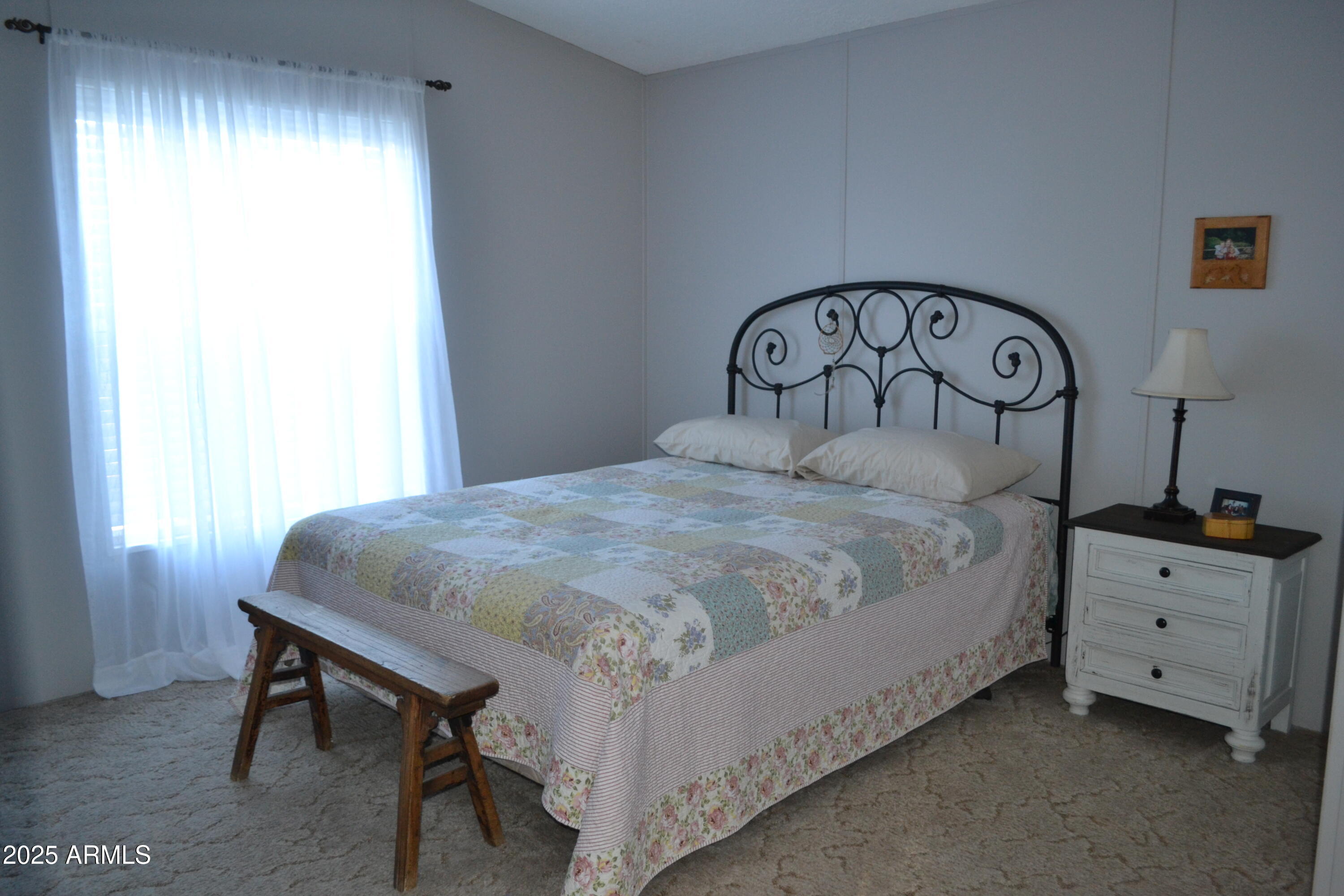 656 Sundown Drive Snowflake, AZ 85937 - Photo 14 of 29 a bedroom with a bed and a table in it