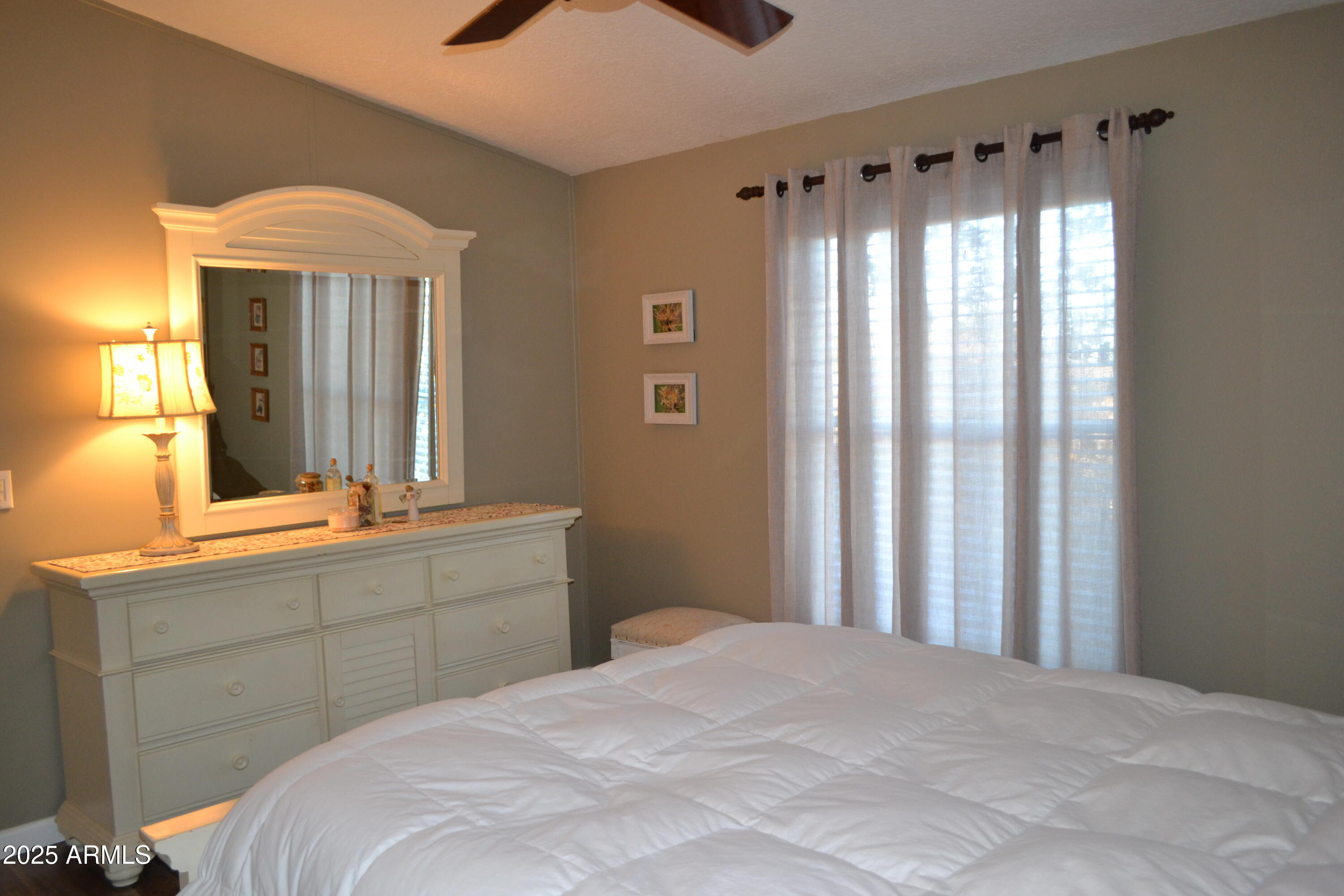 656 Sundown Drive Snowflake, AZ 85937 - Photo 18 of 29 a bedroom with a bed and a window