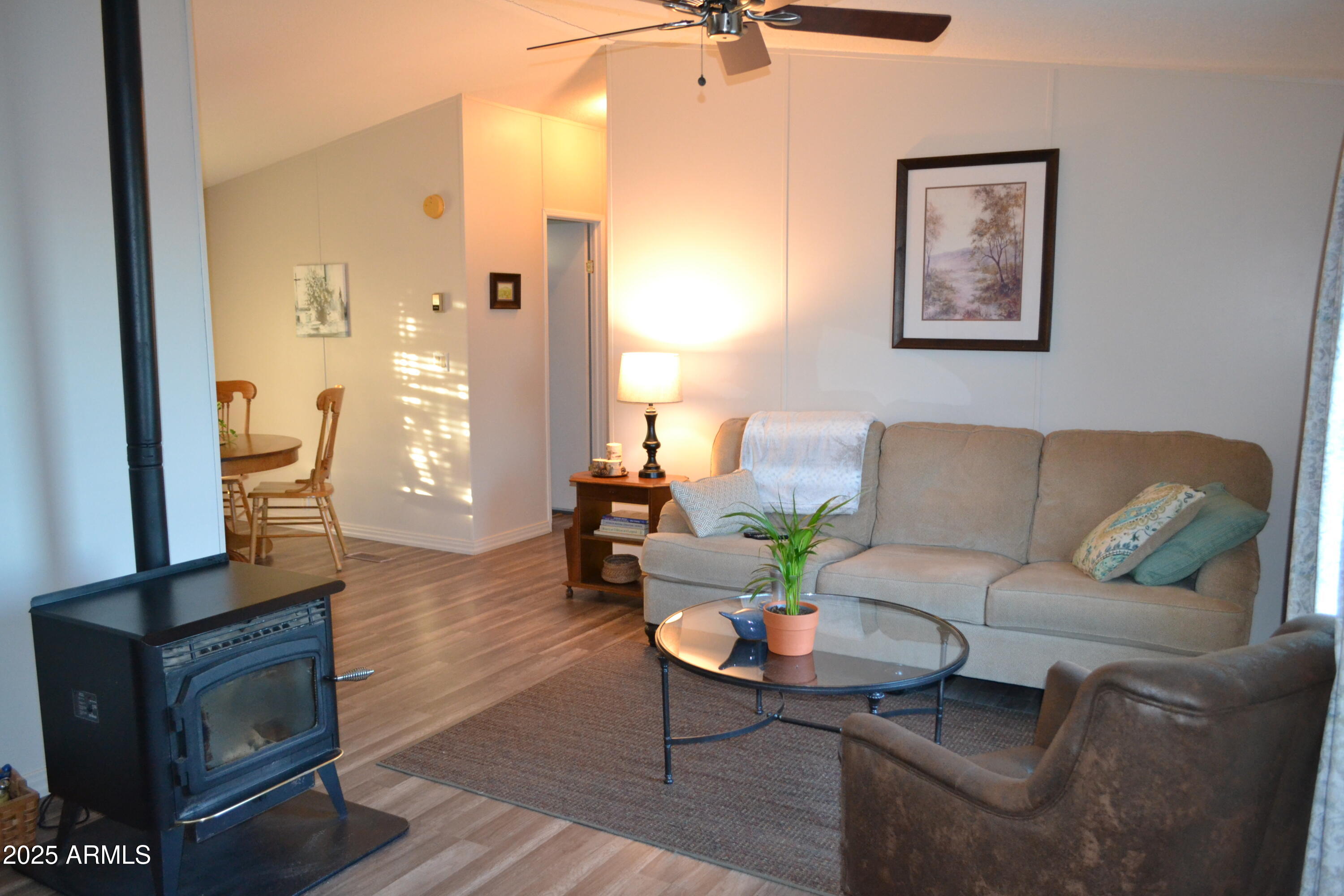 656 Sundown Drive Snowflake, AZ 85937 - Photo 4 of 29 a living room with furniture a wooden floor and a large window