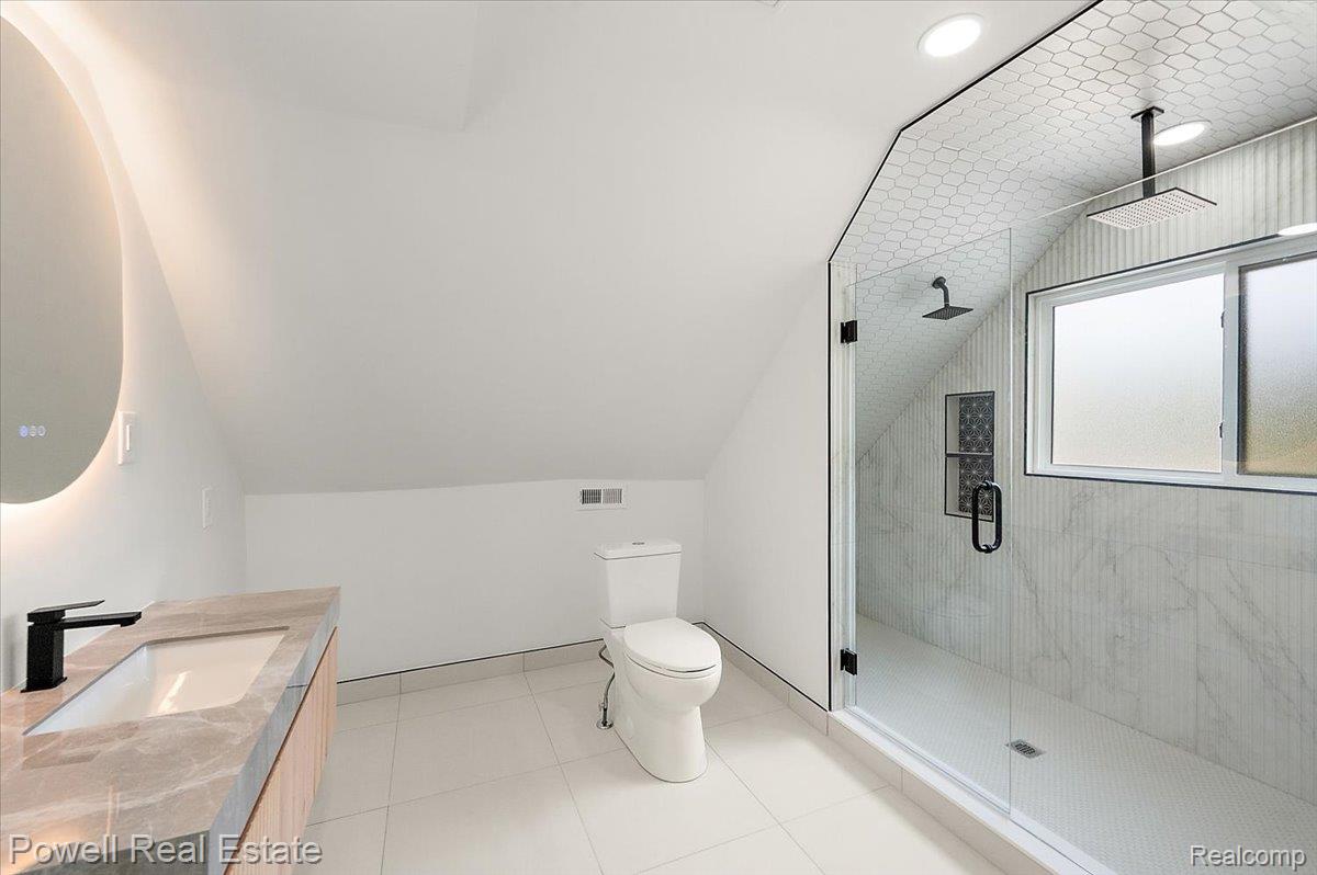 6837 Hatchery Road Waterford, MI 48327 - Photo 43 of 56 Full bathroom with a stall shower, lofted ceiling, vanity, light tile patterned floors, and recessed lighting