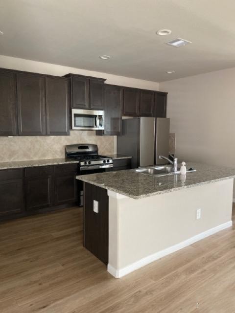 9210 Wood Beach Way Houston, TX 77034 - Photo 8 of 17 a kitchen with stainless steel appliances granite countertop a sink and a stove top oven
