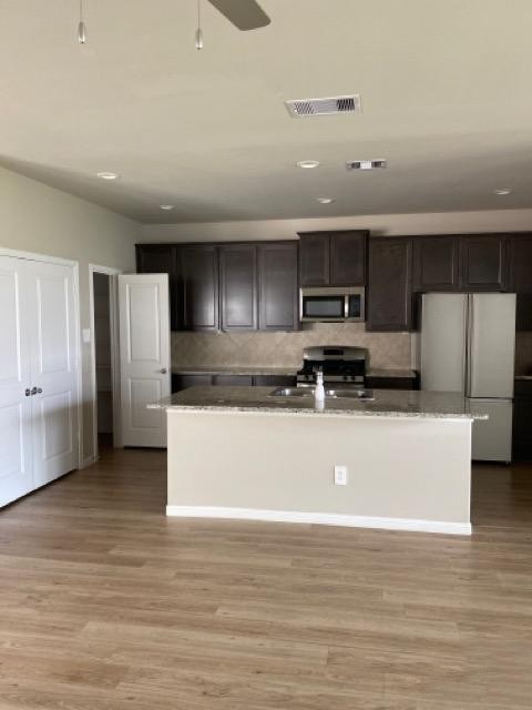 9210 Wood Beach Way Houston, TX 77034 - Photo 9 of 17 a view of kitchen with stainless steel appliances granite countertop a stove a sink and a refrigerator