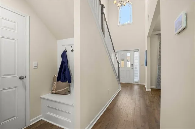 a living room with furniture a wooden floor and a sink