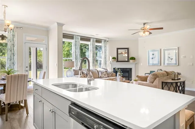 a kitchen with stainless steel appliances a sink a stove and microwave