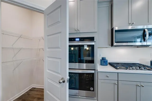 a bathroom with a sink a mirror and a shower