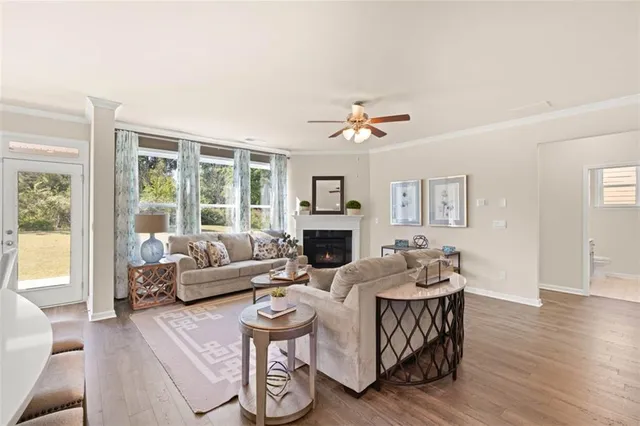 a view of a dining room with furniture and wooden floor