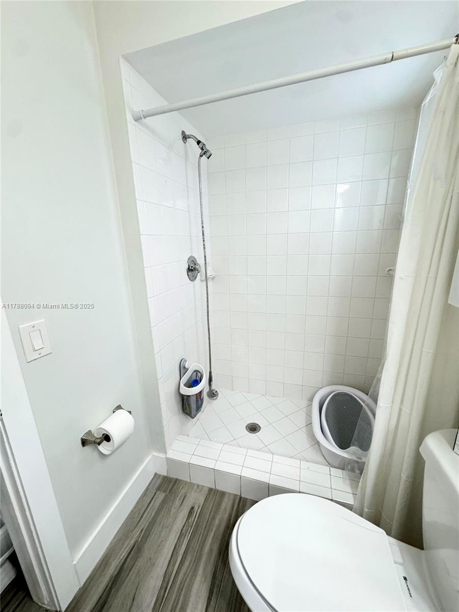 14626 Southwest 128th Court Road Miami, FL 33186 - Photo 13 of 41 a bathroom with a toilet and a shower