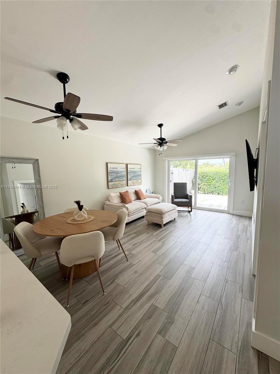 14626 Southwest 128th Court Road Miami, FL 33186 - Photo 24 of 41 a living room with furniture and a window