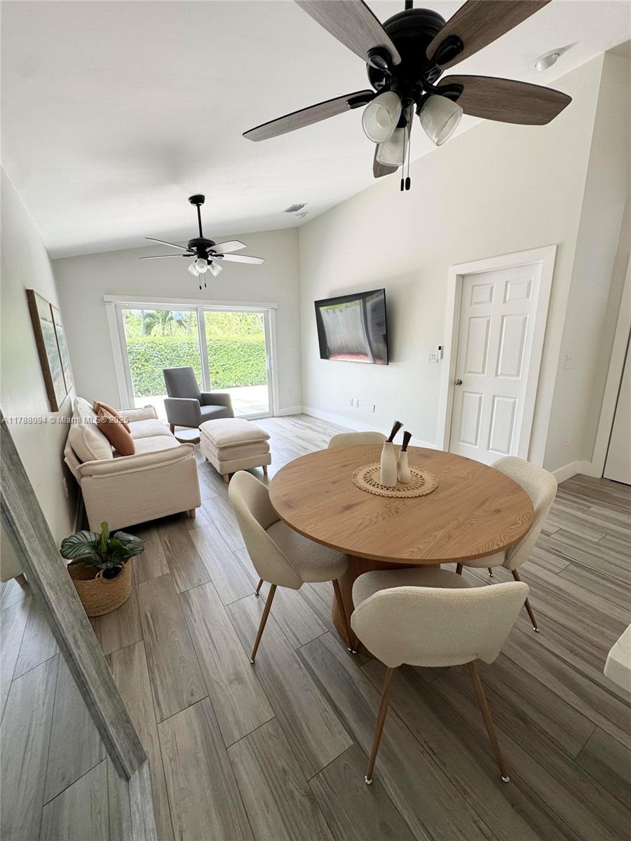 14626 Southwest 128th Court Road Miami, FL 33186 - Photo 25 of 41 a living room with furniture and a wooden floor