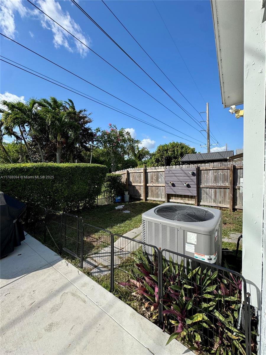 14626 Southwest 128th Court Road Miami, FL 33186 - Photo 34 of 41 a view of a chairs and table in the patio along with potted plants