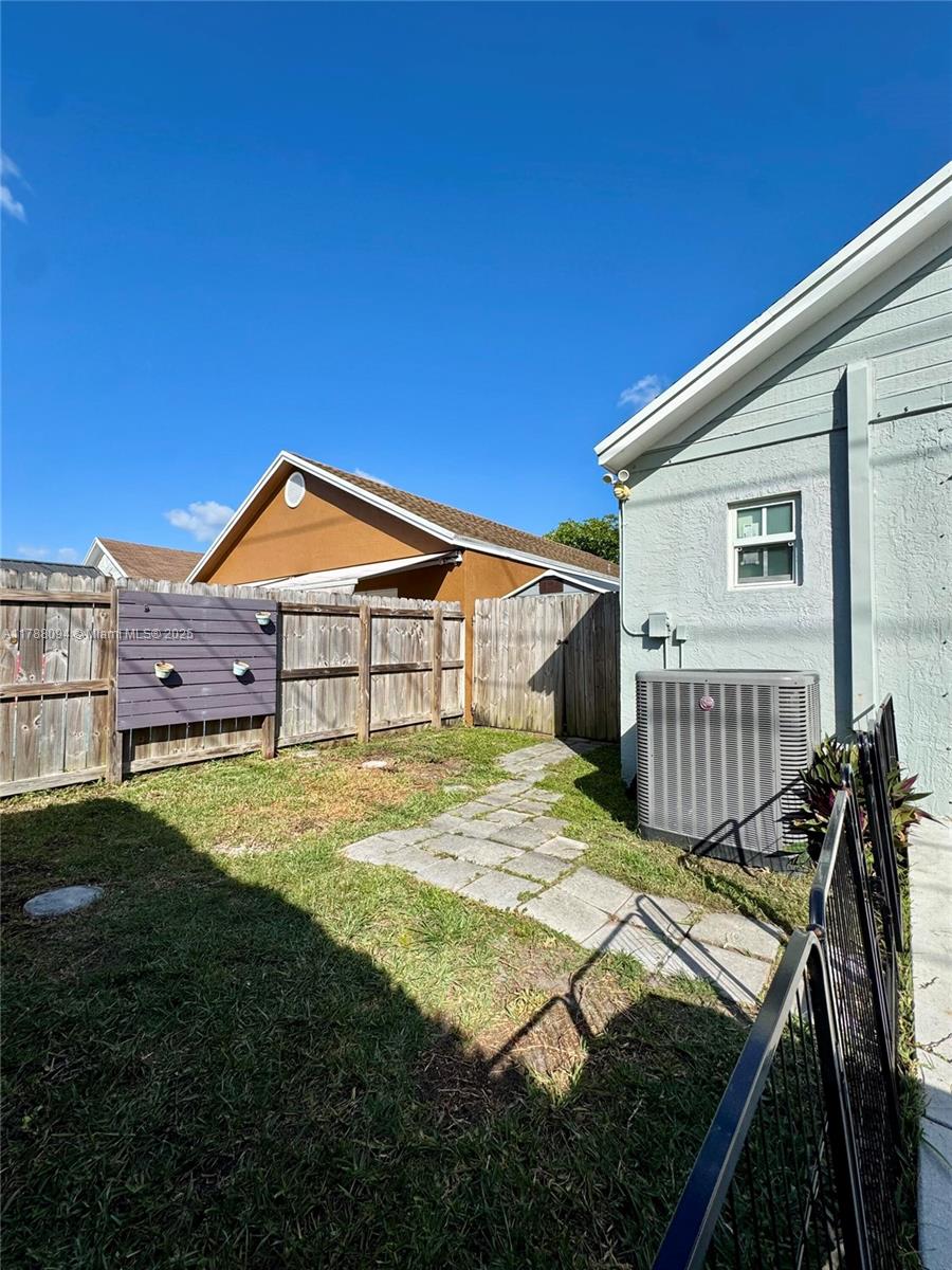 14626 Southwest 128th Court Road Miami, FL 33186 - Photo 36 of 41 a view of an house with backyard and porch