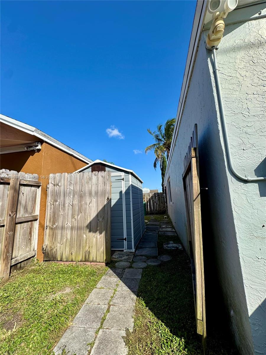 14626 Southwest 128th Court Road Miami, FL 33186 - Photo 37 of 41 a view of a house with a backyard