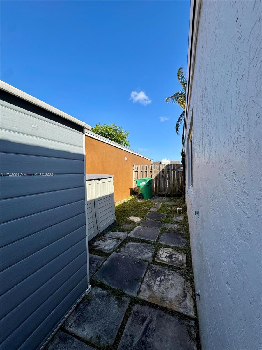14626 Southwest 128th Court Road Miami, FL 33186 - Photo 38 of 41 a view of a backyard with sitting area