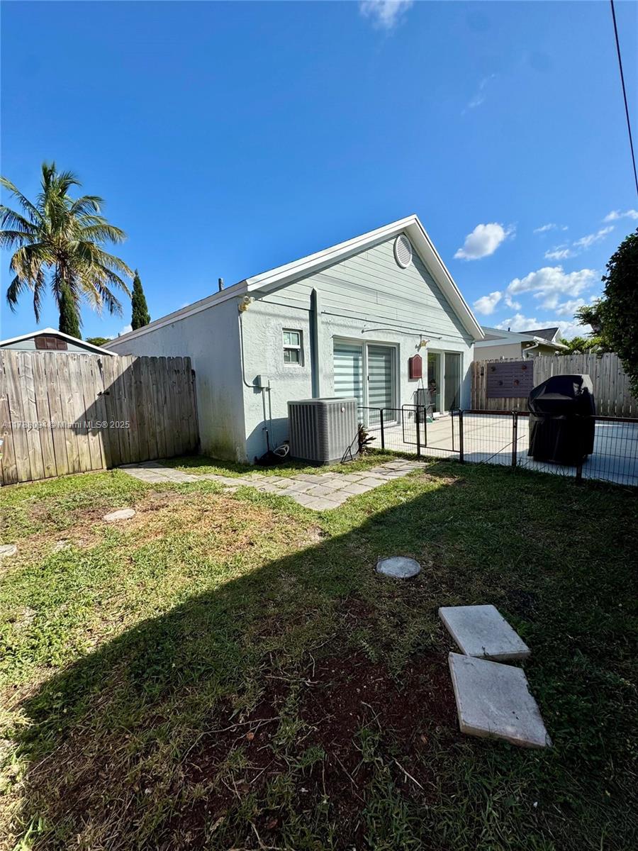 14626 Southwest 128th Court Road Miami, FL 33186 - Photo 41 of 41 a front view of a house with a yard