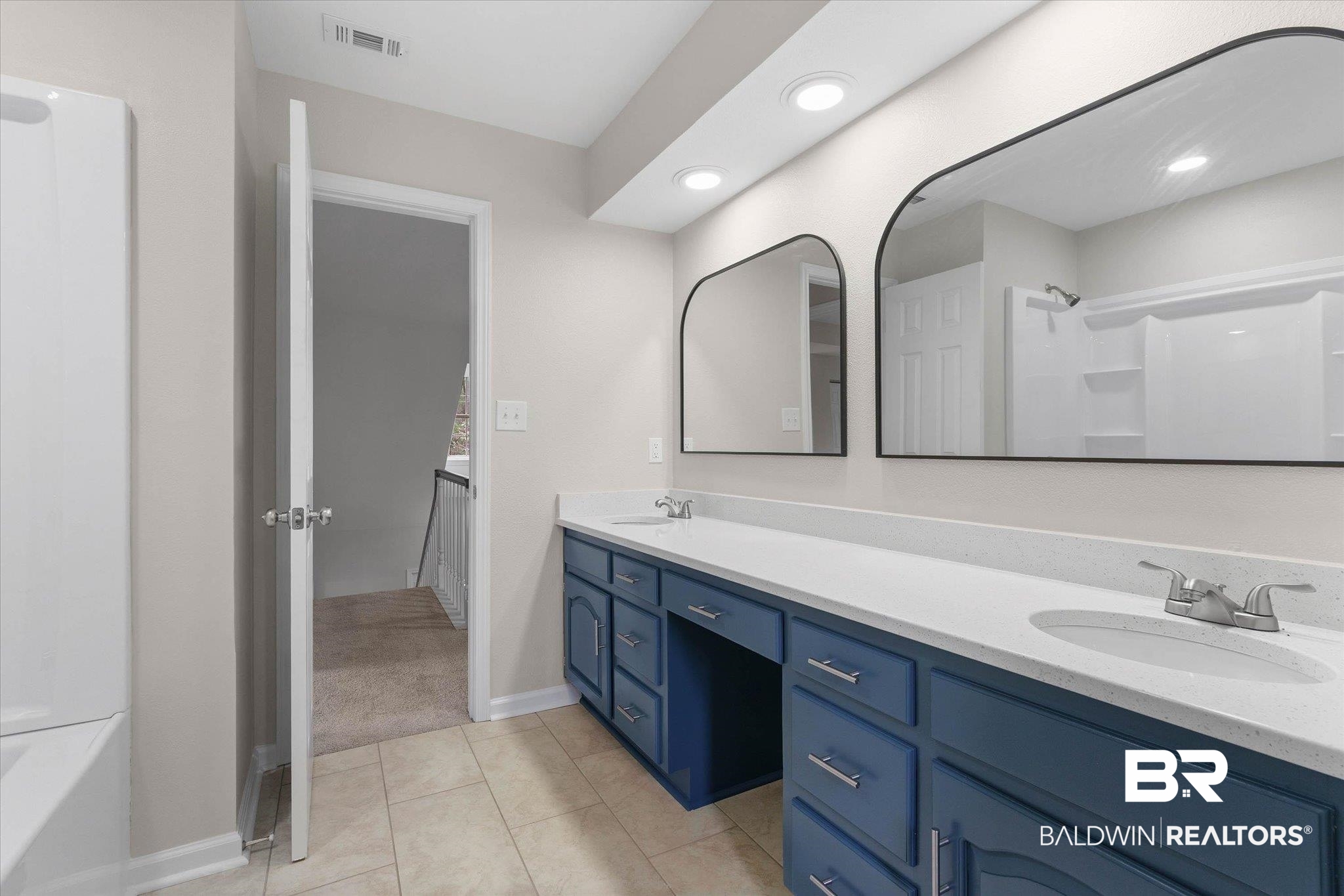 106 Melanie Loop Daphne, AL 36526 - Photo 24 of 45 Bathroom with double vanity and light tile patterned floors
