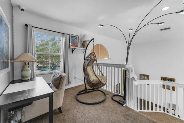 a bedroom with furniture and a window