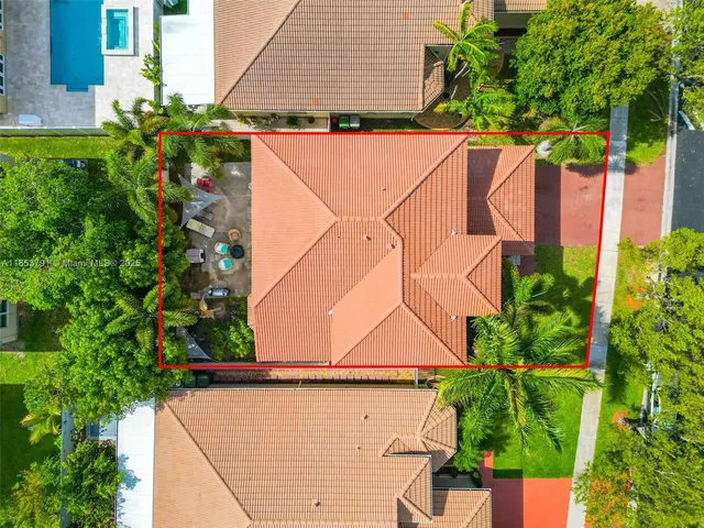 an aerial view of residential houses with outdoor space
