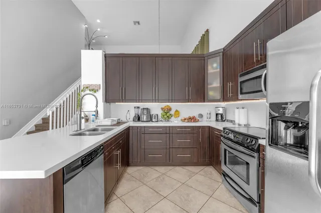 a kitchen with a sink and a large window