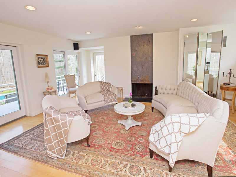 614 Hollow Tree Ridge Road Darien, CT 06820 - Photo 13 of 21 a living room with furniture and wooden floor