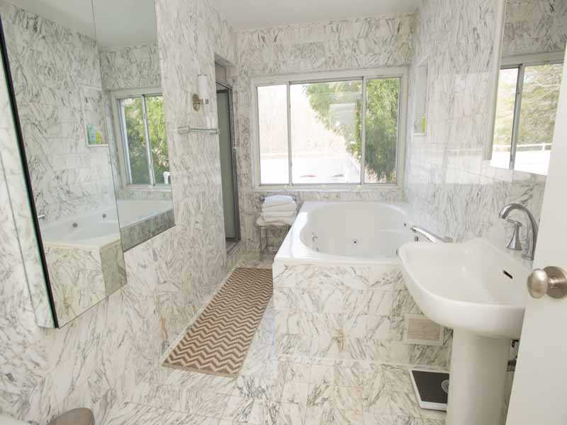 614 Hollow Tree Ridge Road Darien, CT 06820 - Photo 16 of 21 a bath room with a sink and a bath tub