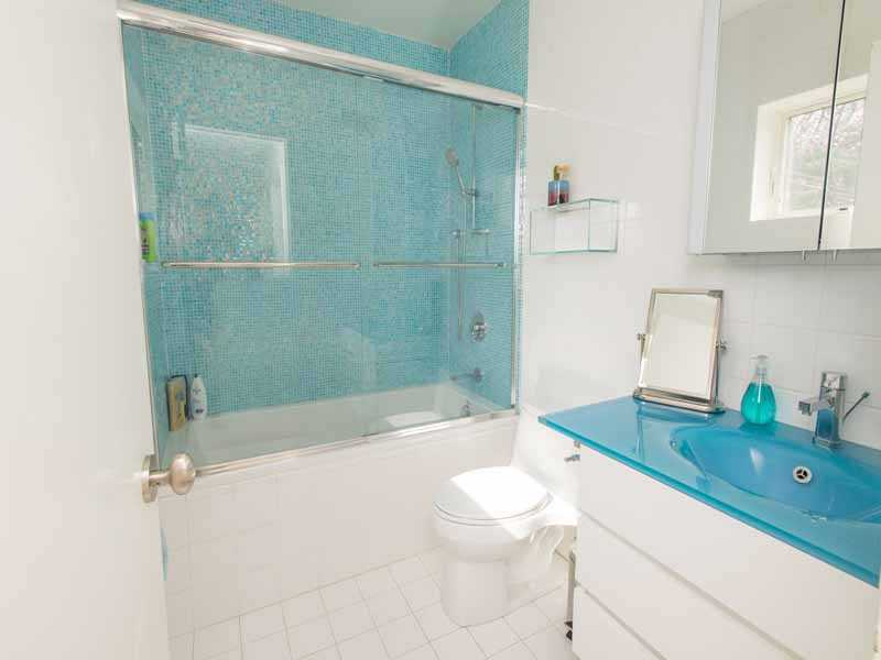 614 Hollow Tree Ridge Road Darien, CT 06820 - Photo 17 of 21 a bathroom with a sink a toilet and shower