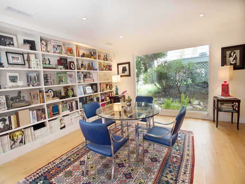 614 Hollow Tree Ridge Road Darien, CT 06820 - Photo 8 of 21 a living room with furniture and a book shelf