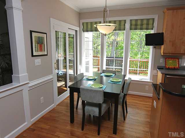 1928 Wilton Circle Raleigh, NC 27615 - Photo 3 of 17 Stylish eat-in-area overlooking a great view of hardwood trees and opens to screened porch for entertaining.