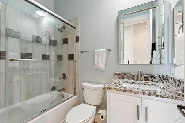 a fireplace with a potted plant