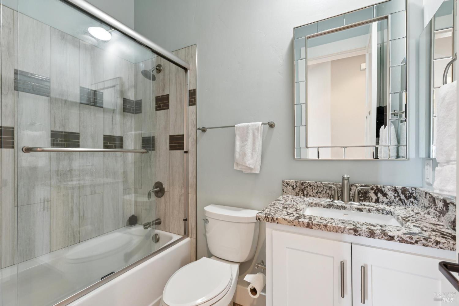 5980 Vista Ridge Santa Rosa, CA 95409 - Photo 12 of 63 a bathroom with a granite countertop sink toilet and shower
