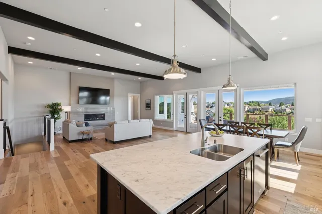 a large kitchen with a table and chairs