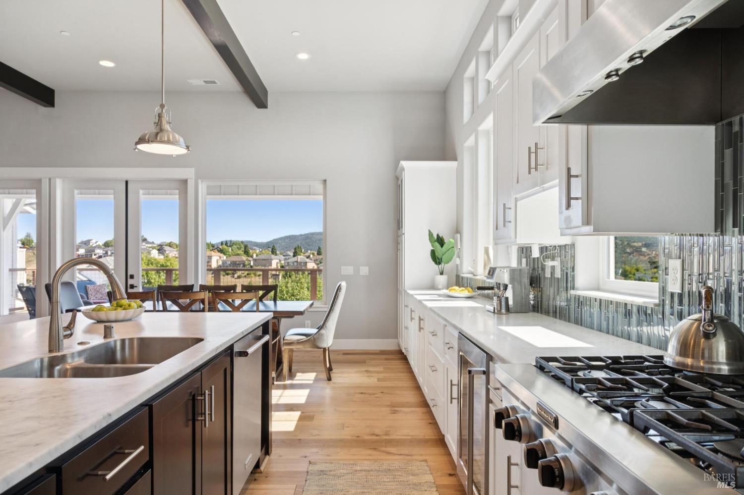 5980 Vista Ridge Santa Rosa, CA 95409 - Photo 25 of 63 a kitchen with stainless steel appliances a sink a stove and a wooden floors