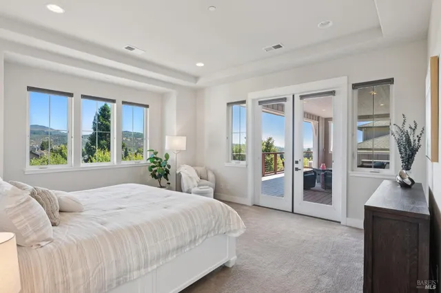 a living room with furniture and a painting