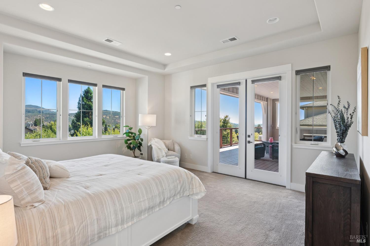 5980 Vista Ridge Santa Rosa, CA 95409 - Photo 33 of 63 a bedroom with a large bed and a flat tv screen