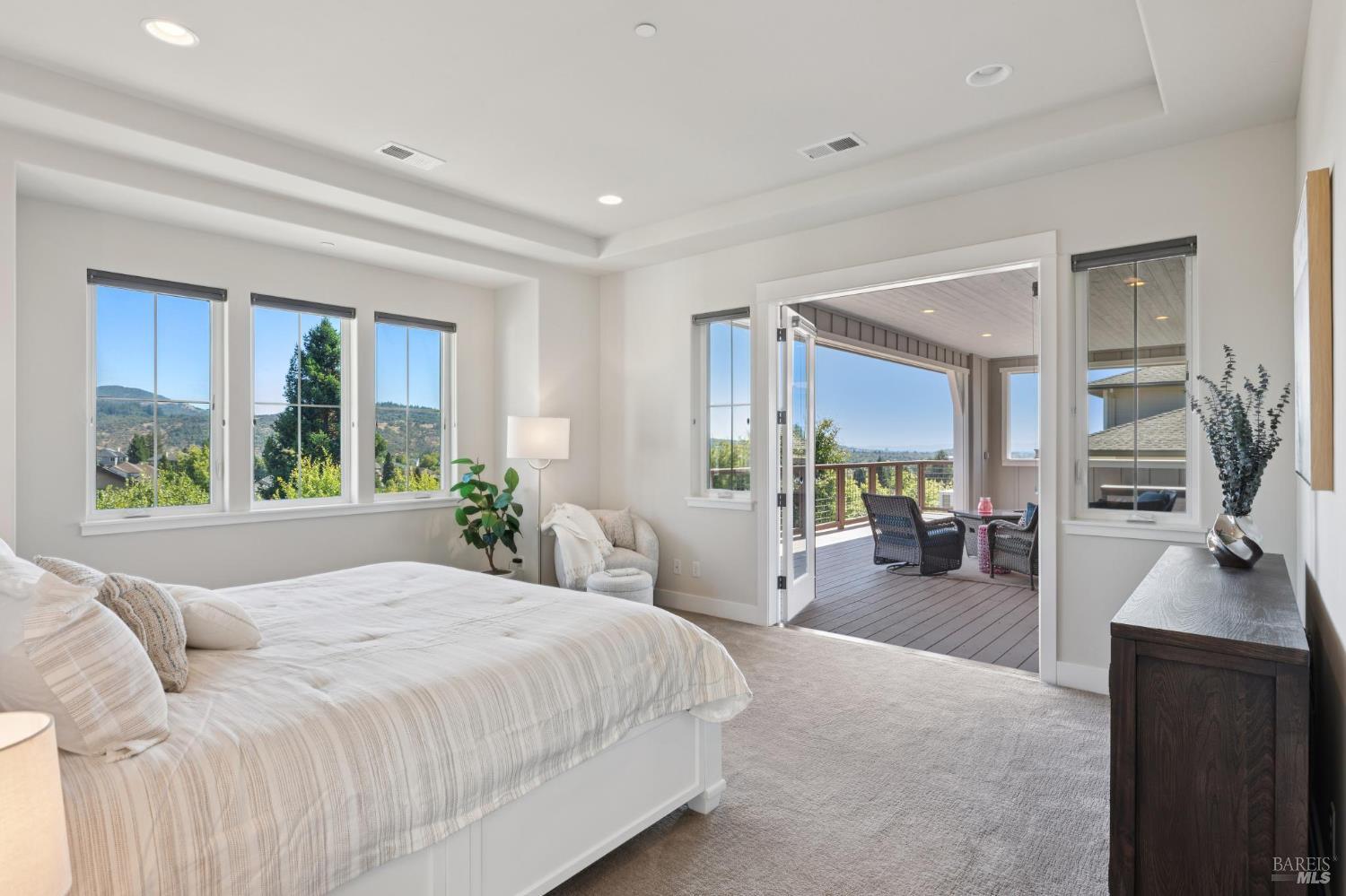 5980 Vista Ridge Santa Rosa, CA 95409 - Photo 34 of 63 a spacious bedroom with a large window and a couch