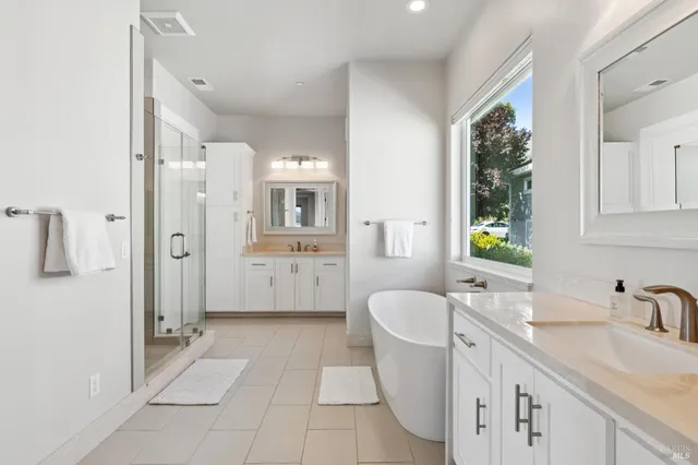 a bedroom with a bed and sliding glass door