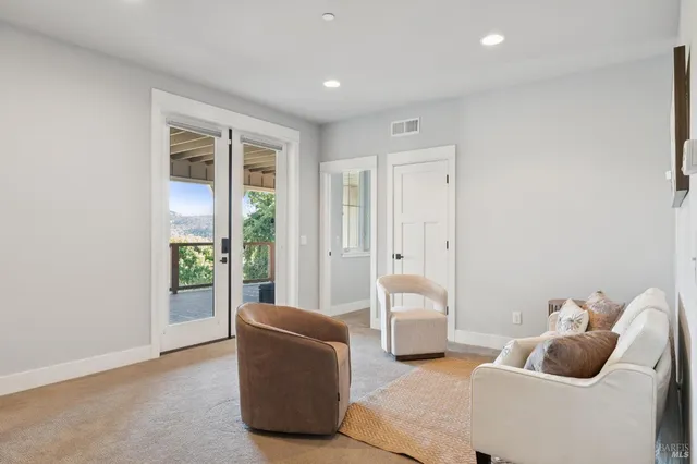 a view of a balcony with wooden floor