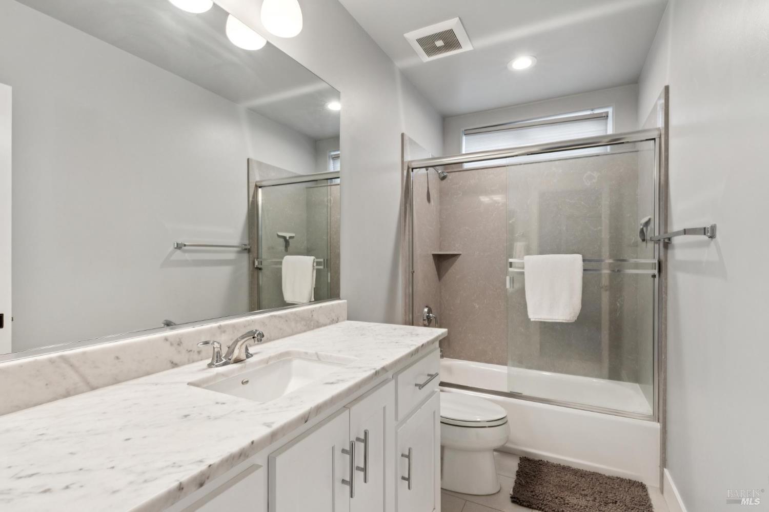 5980 Vista Ridge Santa Rosa, CA 95409 - Photo 45 of 63 a bathroom with a granite countertop sink toilet and shower