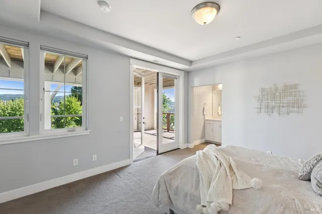 a view of a balcony with wooden floor
