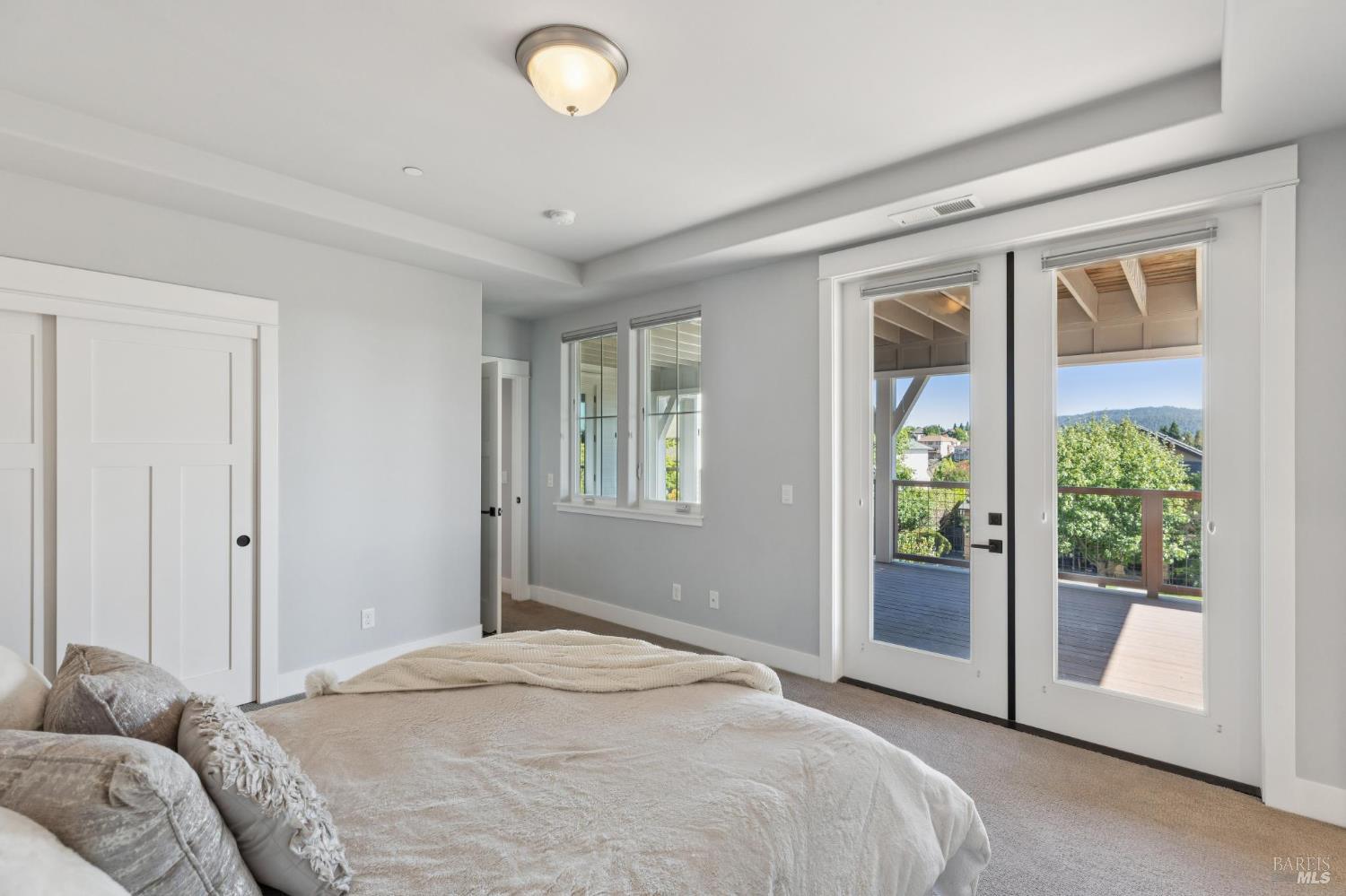 5980 Vista Ridge Santa Rosa, CA 95409 - Photo 48 of 63 a bedroom with a bed and sliding glass door