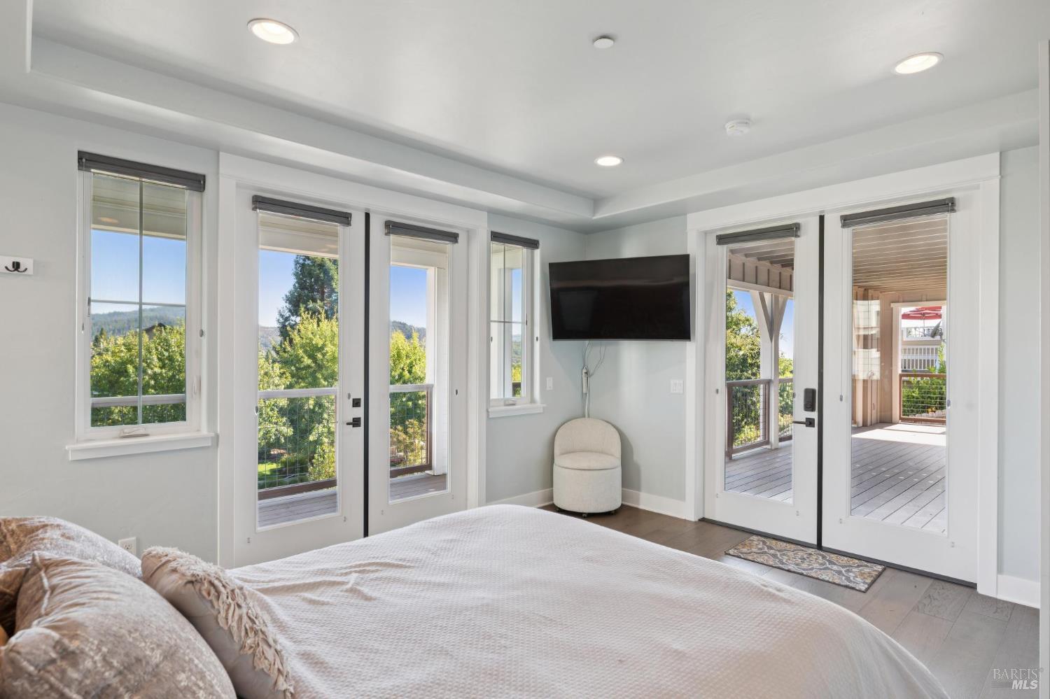 5980 Vista Ridge Santa Rosa, CA 95409 - Photo 55 of 63 a bedroom with a bed and glass door