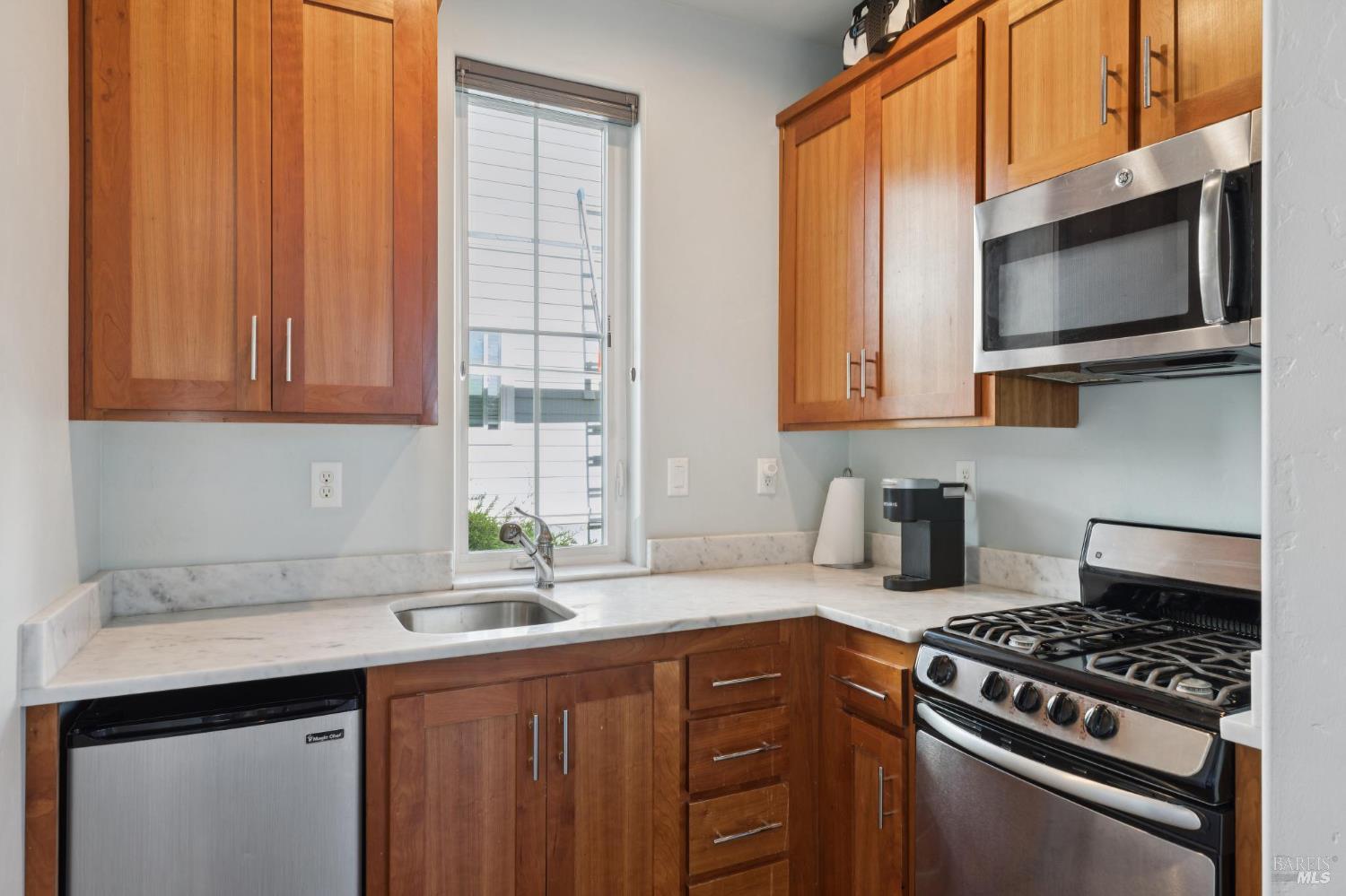 5980 Vista Ridge Santa Rosa, CA 95409 - Photo 56 of 63 a kitchen with stainless steel appliances a sink a stove cabinets and a window