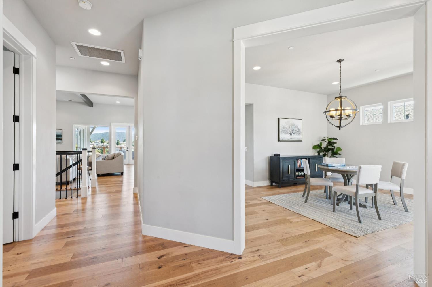 5980 Vista Ridge Santa Rosa, CA 95409 - Photo 7 of 63 a view of a dining room and livingroom with furniture wooden floor a chandelier